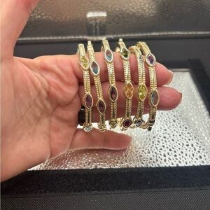 Elegant Gold Cable Genuine Stones Amethyst
Ruby Citrine Aqua Bangle. 65 each